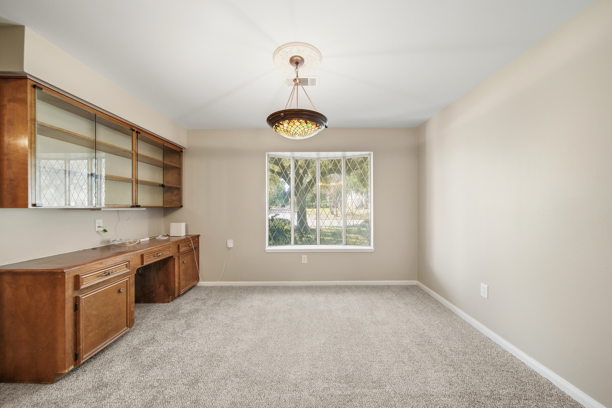 16806 Deep Pines Drive Spring, TX 77379 - Photo 14 of 18 a large kitchen with a window and stainless steel appliances