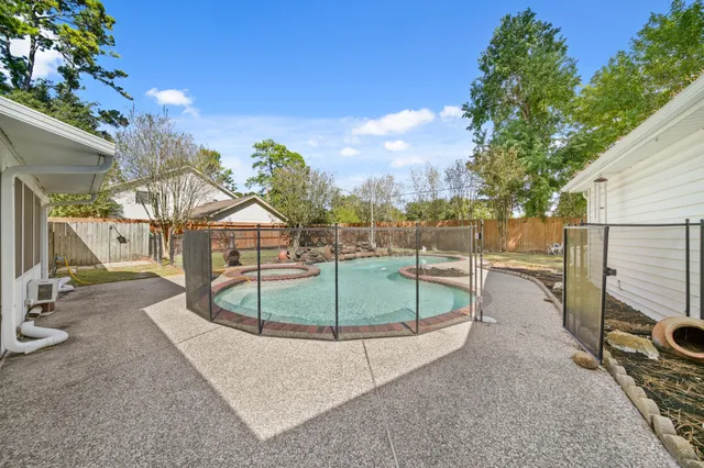 a view of a swimming pool with a patio