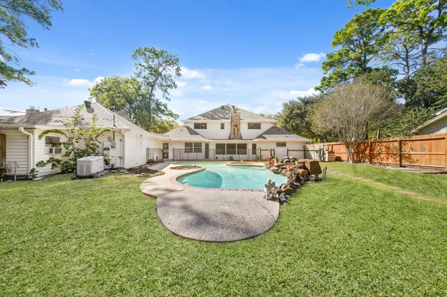 a view of a house with a backyard porch and sitting area