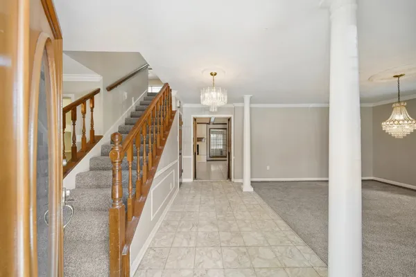 a view of staircase with white walls and stairs