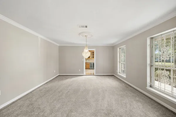 a view of an empty room with a window