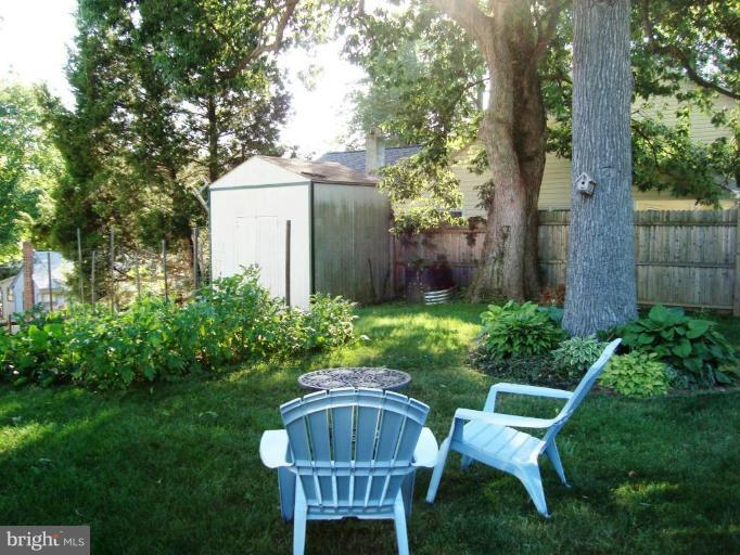 11 Hillcrest Road Riva, MD 21140 - Photo 3 of 28 a view of a wooden chairs and table in backyard of the house