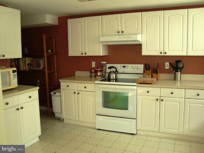 11 Hillcrest Road Riva, MD 21140 - Photo 8 of 28 a kitchen with stainless steel appliances granite countertop a sink stove and refrigerator