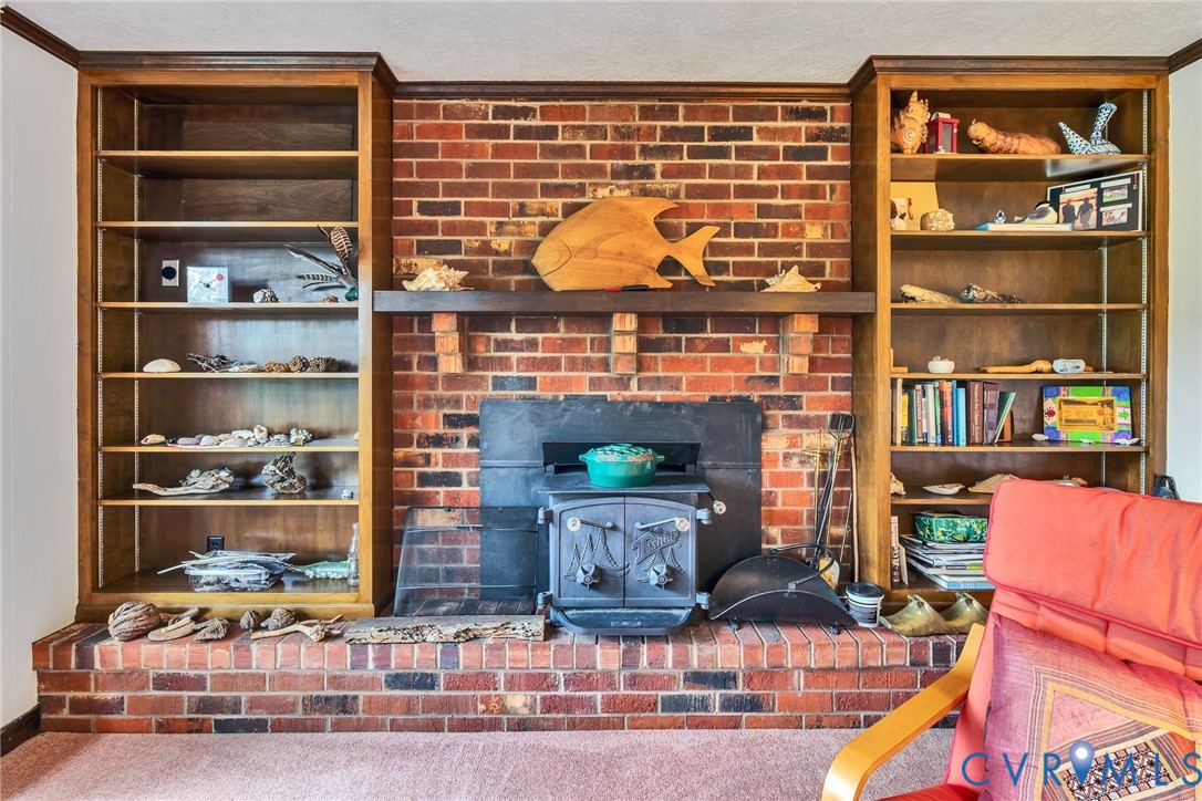 142 Bridge Lane Reedville, VA 22539 - Photo 8 of 56 a room with furniture and a book shelf