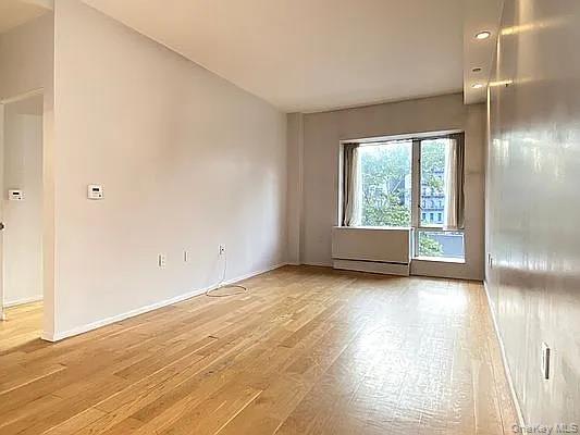2280 Frederick Douglass Boulevard Manhattan, NY 10027 - Photo 9 of 16 Spare room featuring light wood finished floors