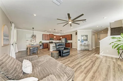 a living room with furniture fireplace and flat screen tv