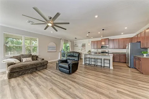 a view of livingroom with hardwood floor and a ceiling fan