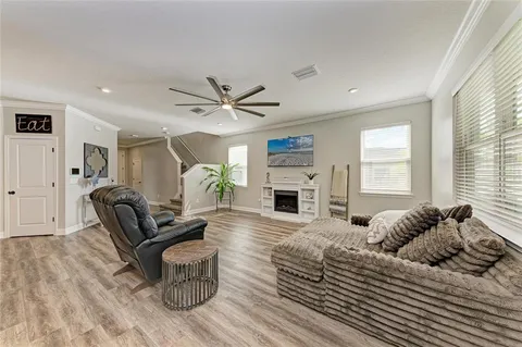 a bedroom with a bed and a ceiling fan