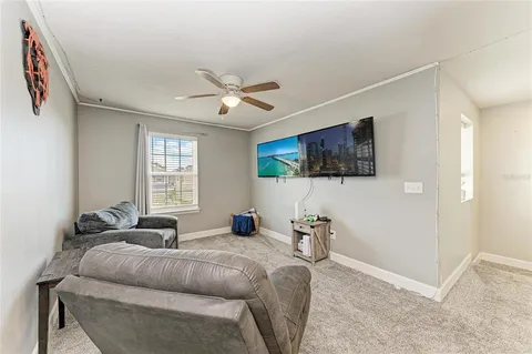 a lobby with furniture and floor to ceiling window