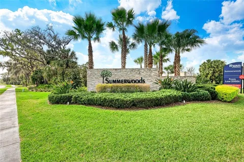 a view of swimming pool with outdoor seating