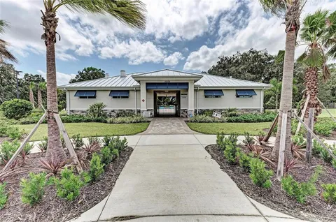 a view of a patio with a dining table and chairs