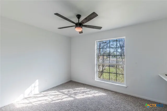 a bathroom with a sink toilet vanity and shower