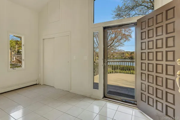 a kitchen with stainless steel appliances granite countertop a stove top oven a sink dishwasher a refrigerator and cabinets with wooden floor