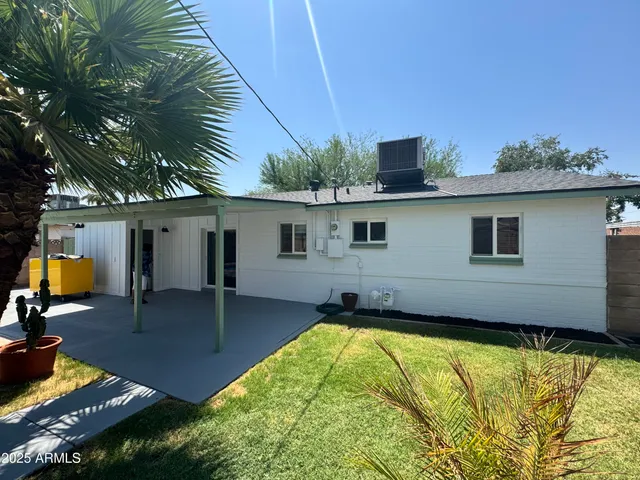 a view of a backyard with a patio