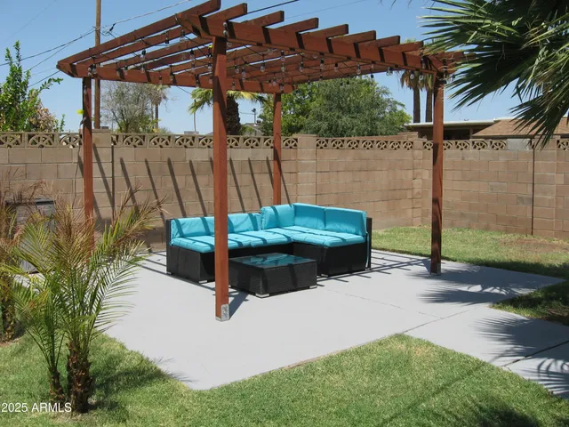 a view of a swimming pool with a patio
