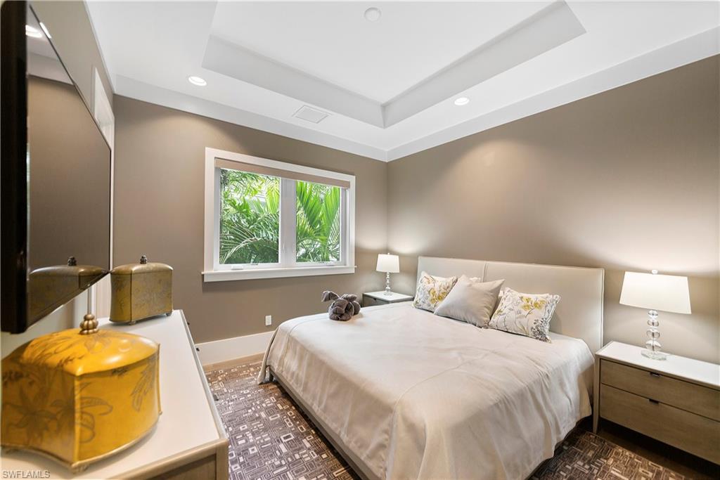 9169 Mercato Way Naples, FL 34108 - Photo 14 of 25 a bedroom with a bed and window