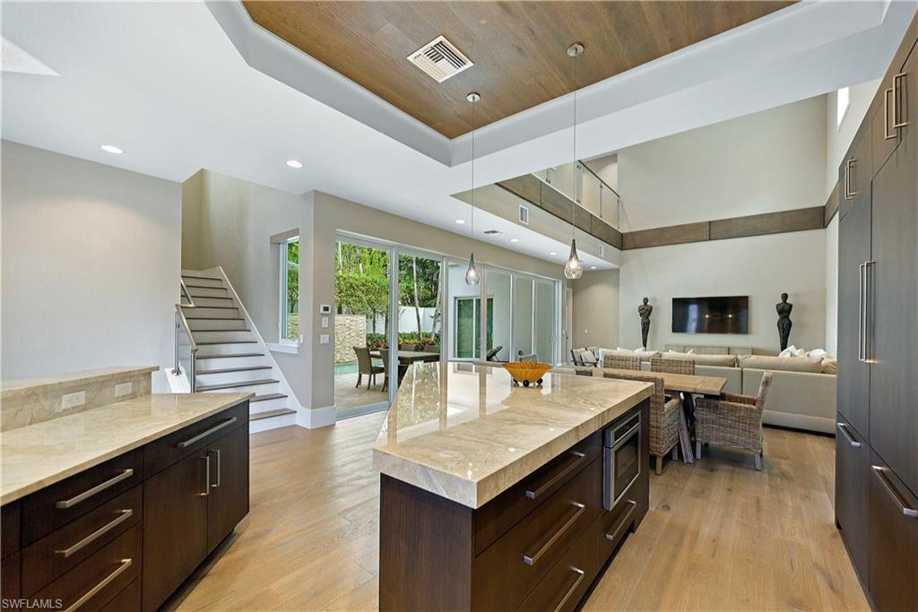 9169 Mercato Way Naples, FL 34108 - Photo 17 of 25 a living room with stainless steel appliances granite countertop lots of counter top space