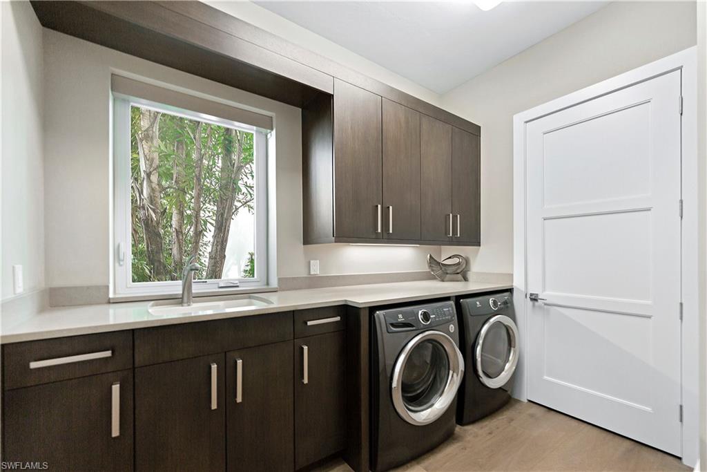 9169 Mercato Way Naples, FL 34108 - Photo 19 of 25 a utility room with dryer and washer
