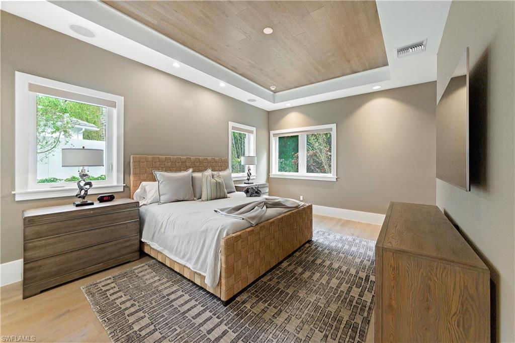 9169 Mercato Way Naples, FL 34108 - Photo 22 of 25 a room with a bed and a window
