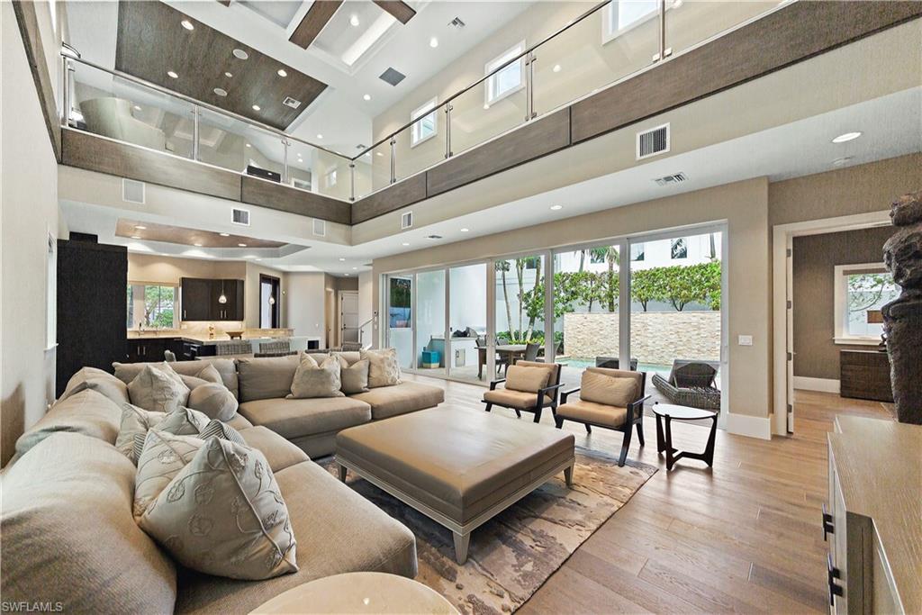 9169 Mercato Way Naples, FL 34108 - Photo 6 of 25 a living room with furniture and a large window