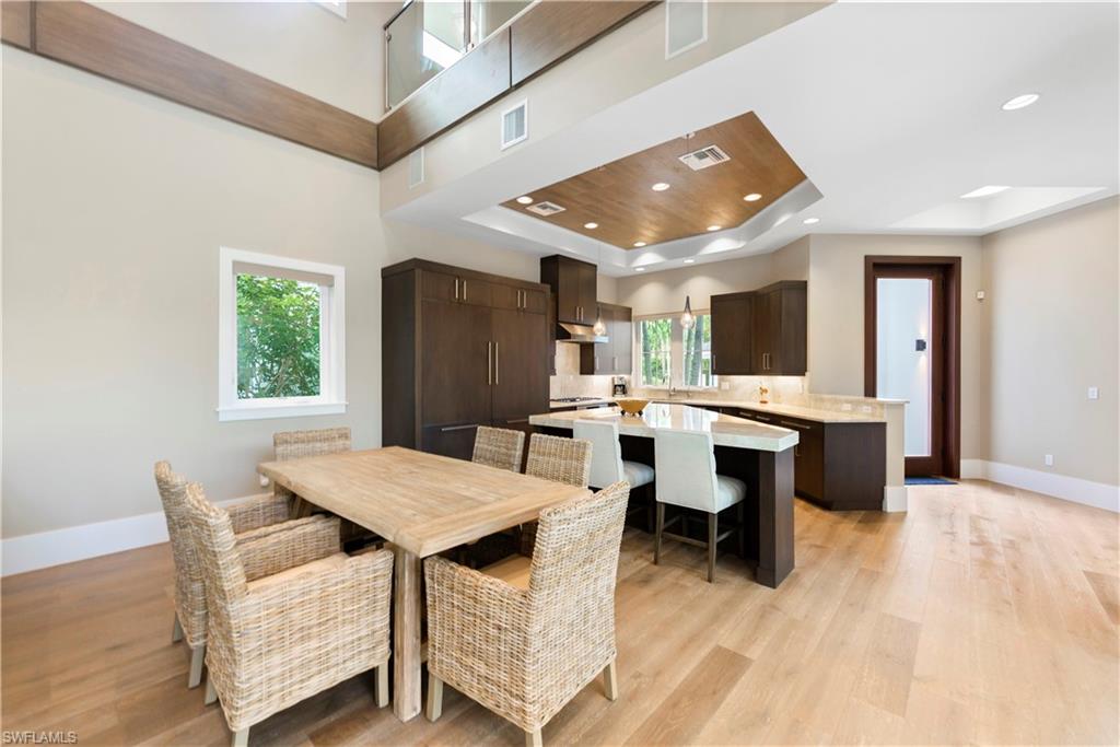 9169 Mercato Way Naples, FL 34108 - Photo 8 of 25 a view of a dining room with furniture and window