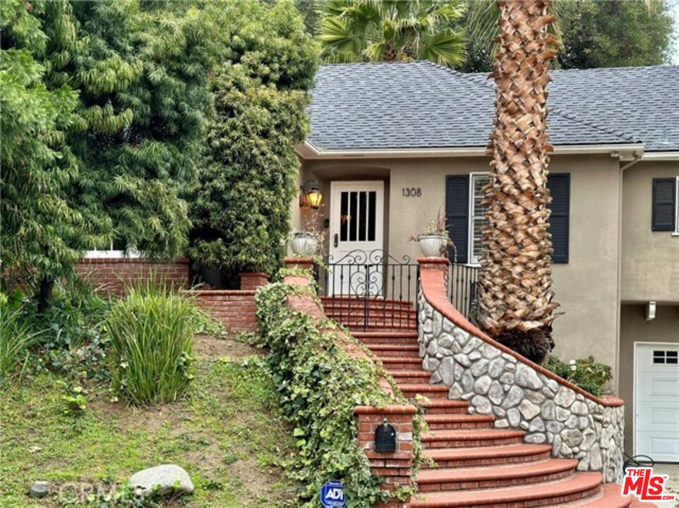 1308 Opechee Way Glendale, CA 91208 - Photo 15 of 33 a front view of a house with a yard