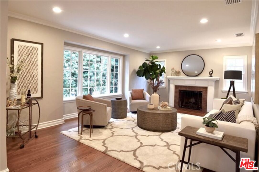 1308 Opechee Way Glendale, CA 91208 - Photo 2 of 33 a living room with furniture a window and a fireplace
