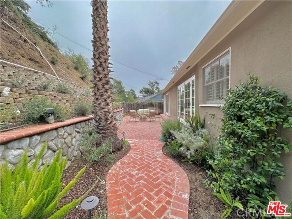 1308 Opechee Way Glendale, CA 91208 - Photo 29 of 33 a view of a pathway with a garden