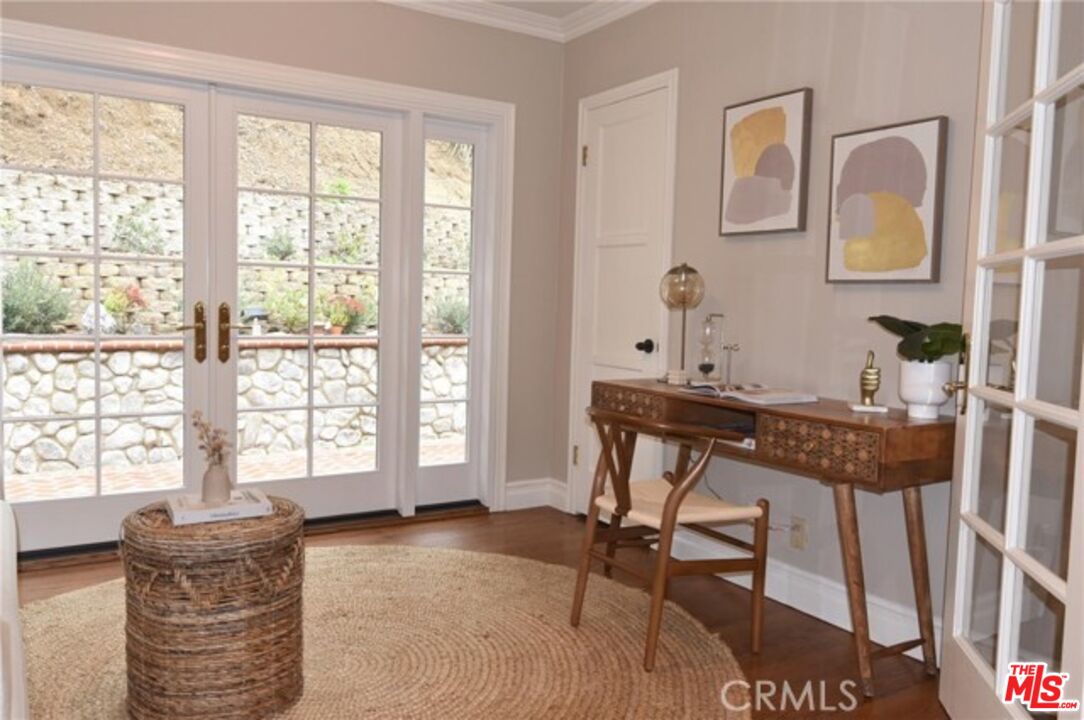 1308 Opechee Way Glendale, CA 91208 - Photo 9 of 33 a workspace with furniture and a window