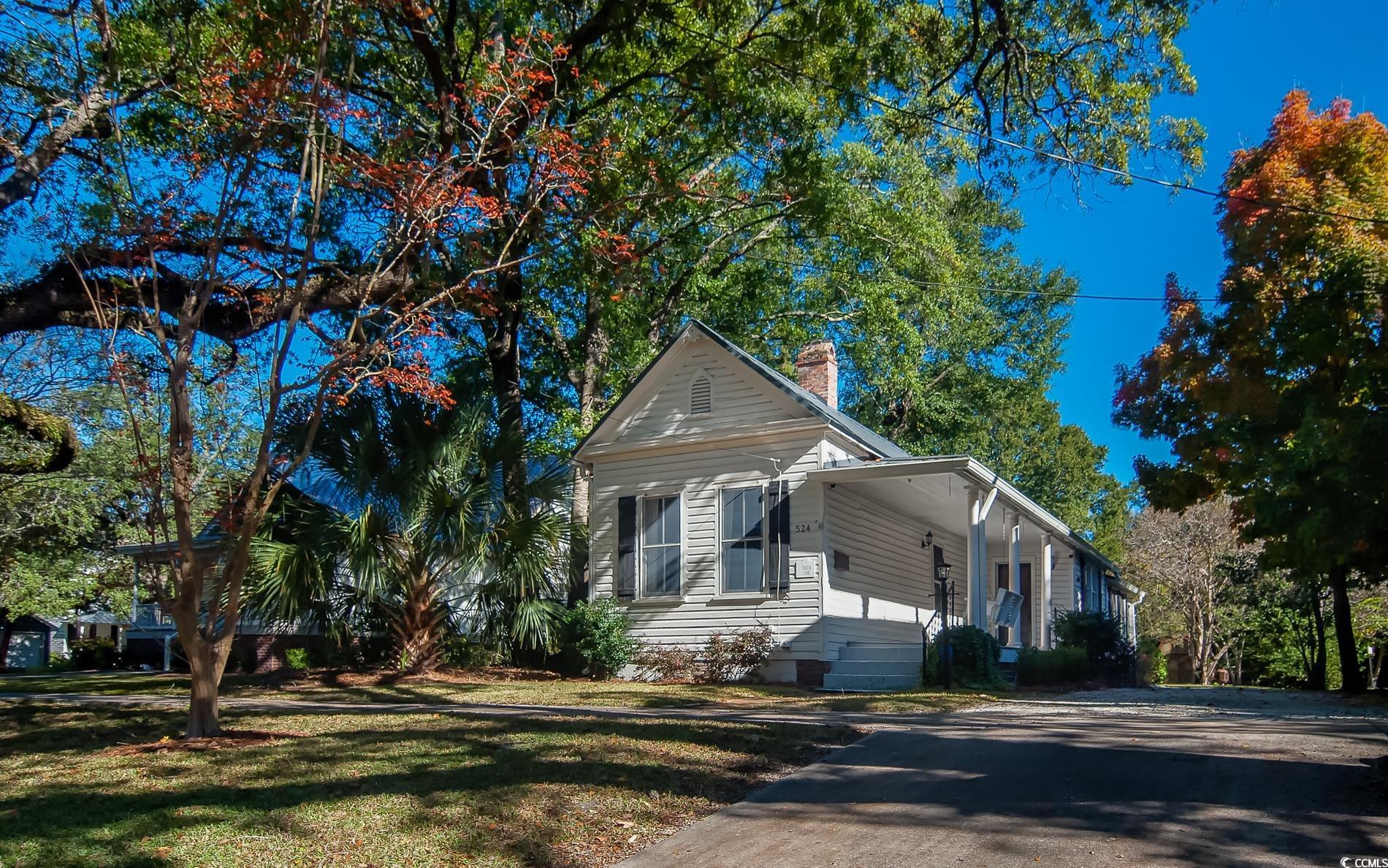 524 Highmarket Street Georgetown, SC 29440 - Photo 2 of 27 View of front facade with a chimney, a front lawn, and crawl space