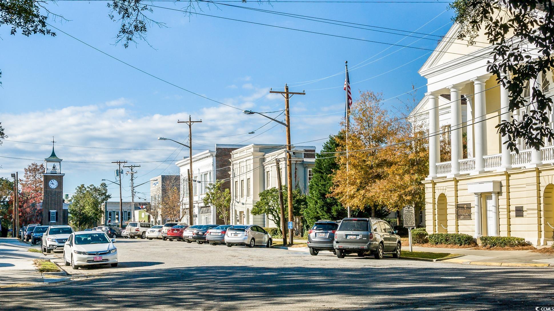 524 Highmarket Street Georgetown, SC 29440 - Photo 25 of 27 View of asphalt road with street lighting, sidewalks, and curbs