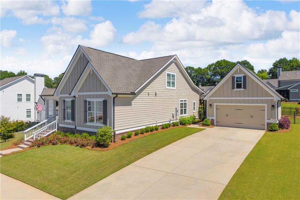 943 Clubside Drive Monroe, GA 30655 - Photo 2 of 24 a view of a house with yard and a street