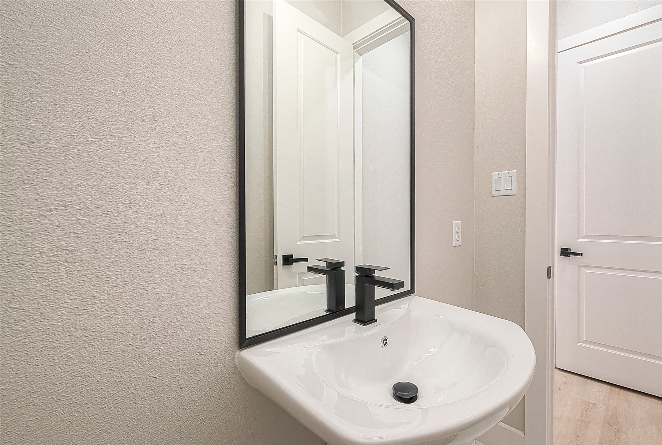 3835 Mainer Street Houston, TX 77021 - Photo 20 of 21 a bathroom with a sink and a mirror