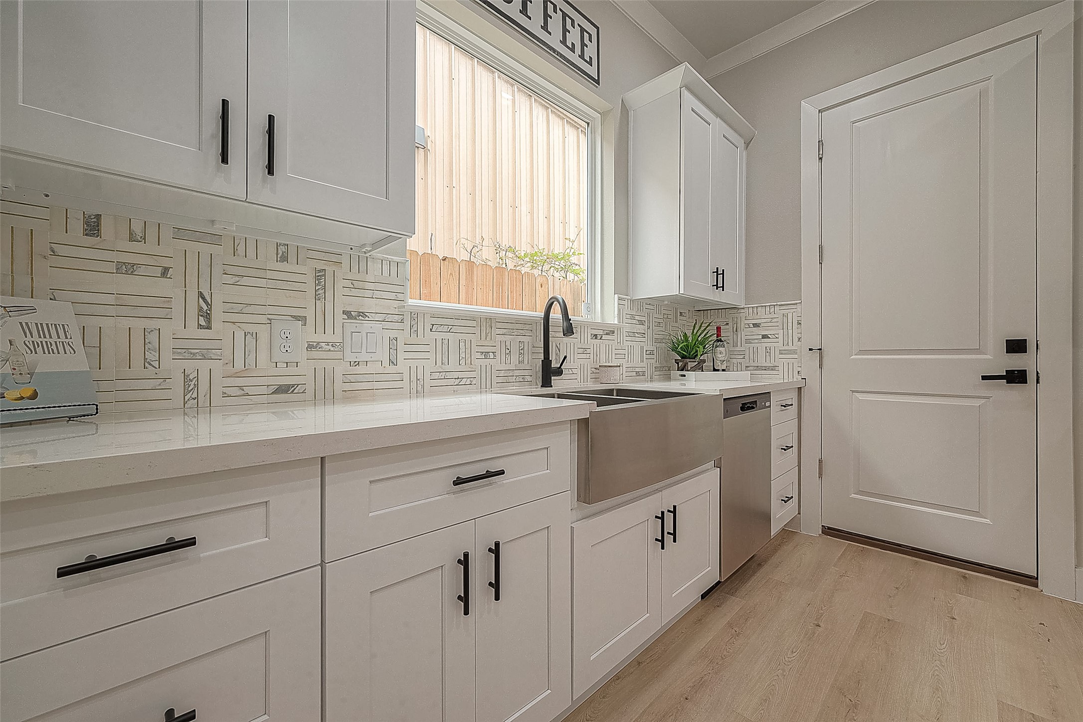 3835 Mainer Street Houston, TX 77021 - Photo 5 of 21 a kitchen with white cabinets and sink