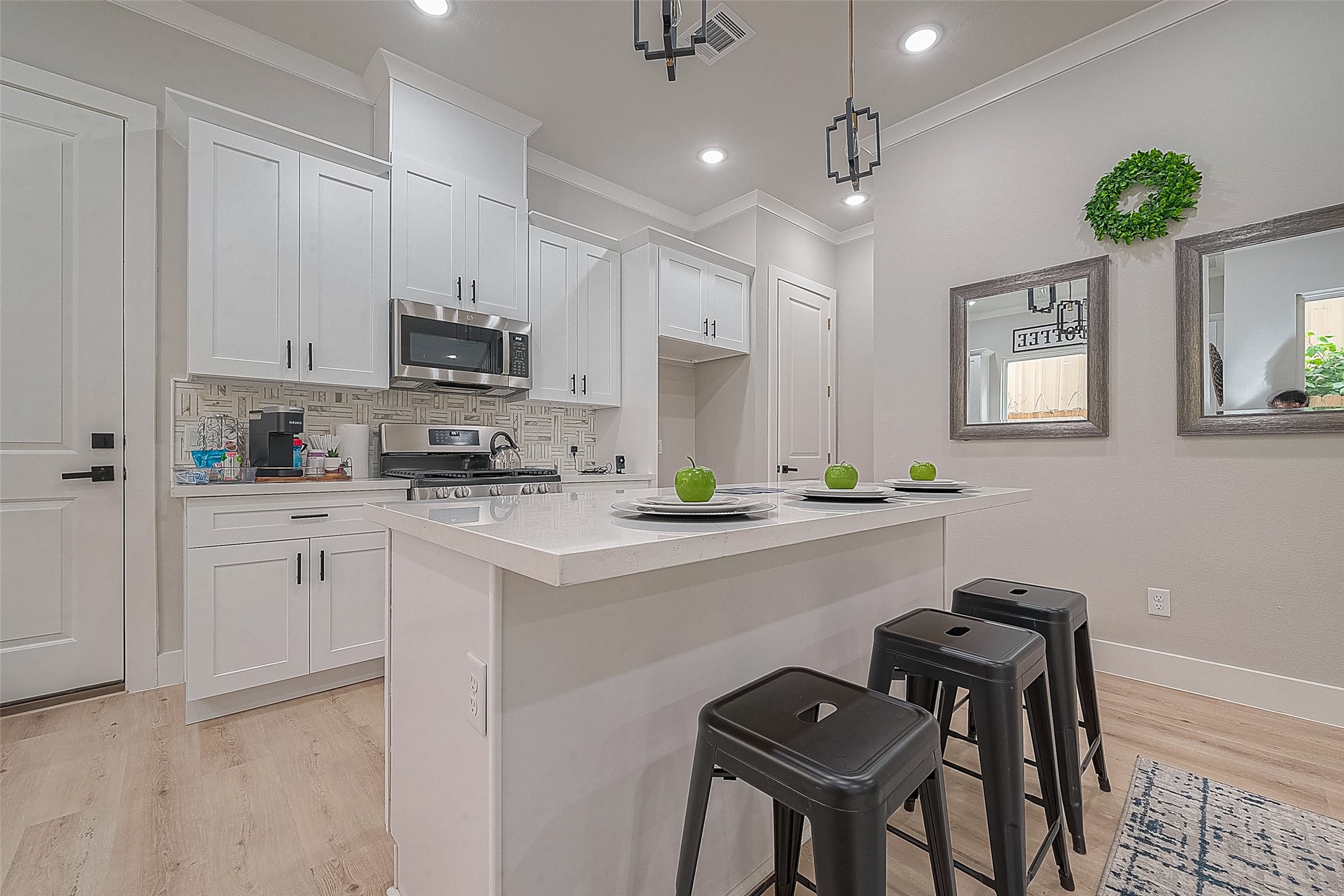 3835 Mainer Street Houston, TX 77021 - Photo 6 of 21 a kitchen with stainless steel appliances kitchen island a refrigerator and a stove top oven