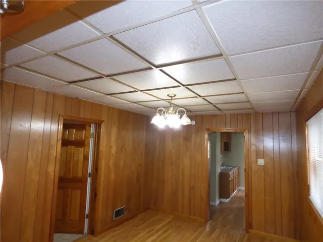 a view of hallway with wooden floor