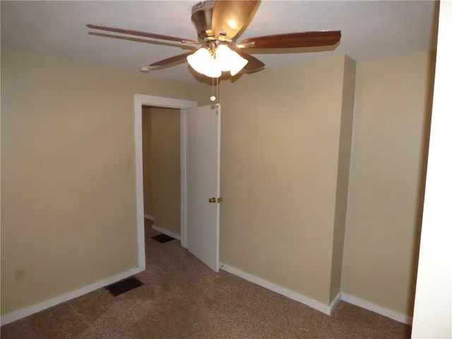 a view of a chandelier fan in a room