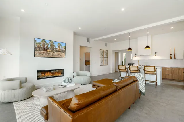 a bedroom with a bed and large window