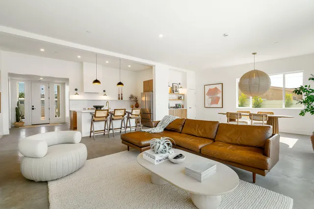a bedroom with a bed and glass door