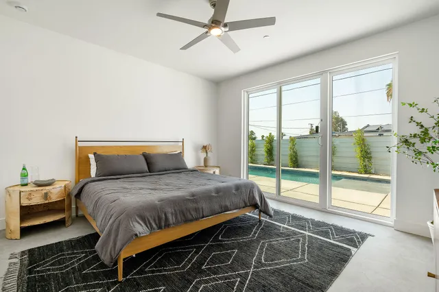 a bathroom with a shower sink and mirror
