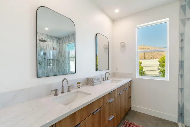 a view of a kitchen with white cabinets