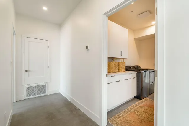 a view of a hallway with closet