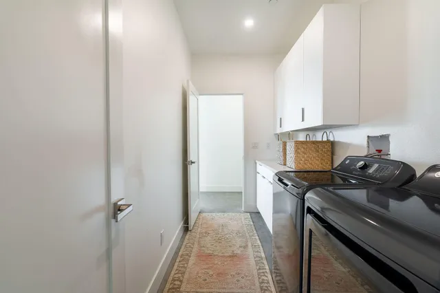 a bathroom with a sink mirror toilet and shower