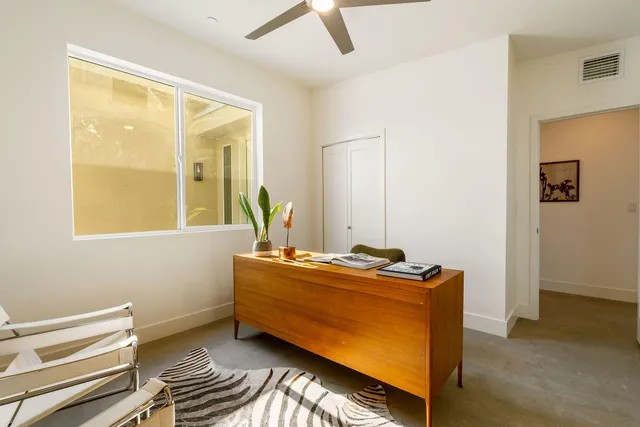 a view of a swimming pool with a lounge chair