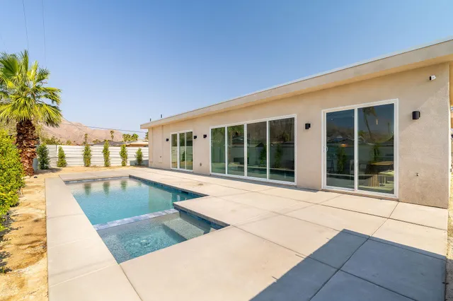 a view of a balcony with chairs