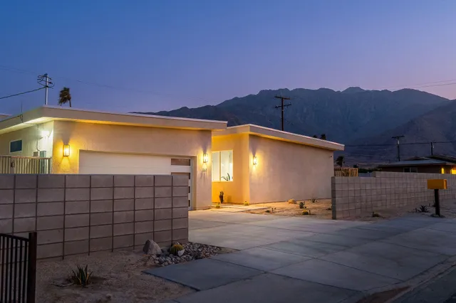 a view of roof deck with outdoor seating and city view