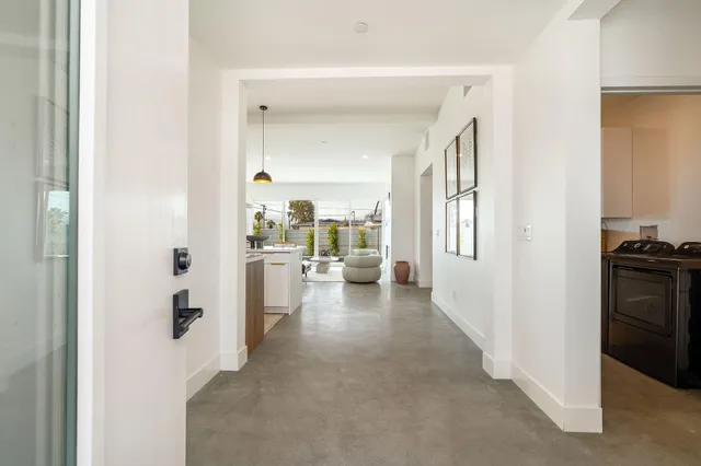 a kitchen with a table and chairs