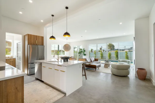 a kitchen with a table and chairs in it