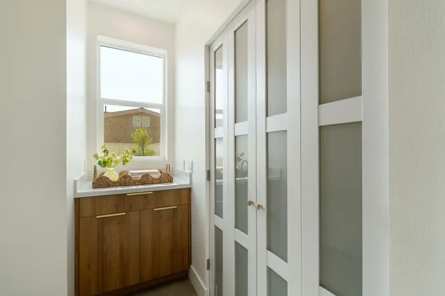 a kitchen with a table chairs and a stove