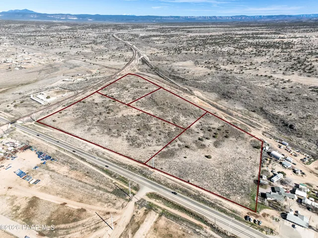 a view of a yard with wooden floor